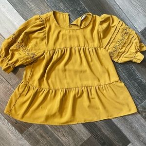 entro yellow tiered blouse with puff sleeve and lace accent